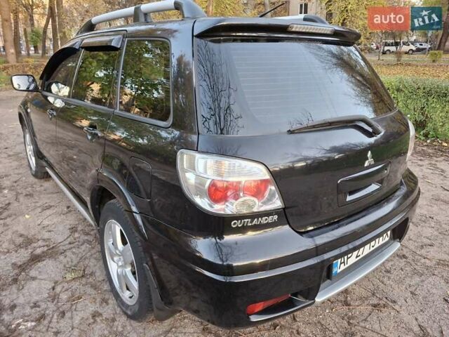 Чорний Міцубісі Аутлендер, об'ємом двигуна 2.38 л та пробігом 245 тис. км за 6800 $, фото 5 на Automoto.ua
