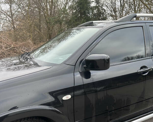 Чорний Міцубісі Аутлендер, об'ємом двигуна 2 л та пробігом 118 тис. км за 8100 $, фото 16 на Automoto.ua