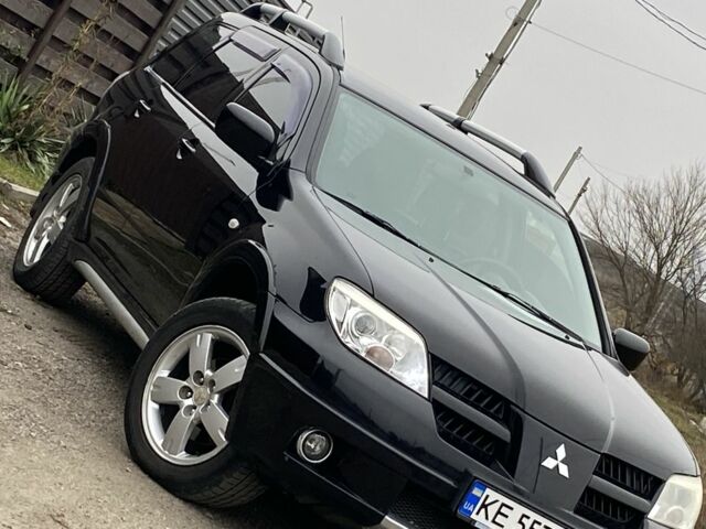 Черный Мицубиси Аутлендер, объемом двигателя 2.4 л и пробегом 178 тыс. км за 6900 $, фото 1 на Automoto.ua