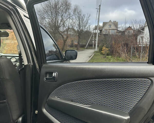 Чорний Міцубісі Аутлендер, об'ємом двигуна 2 л та пробігом 118 тис. км за 8100 $, фото 22 на Automoto.ua