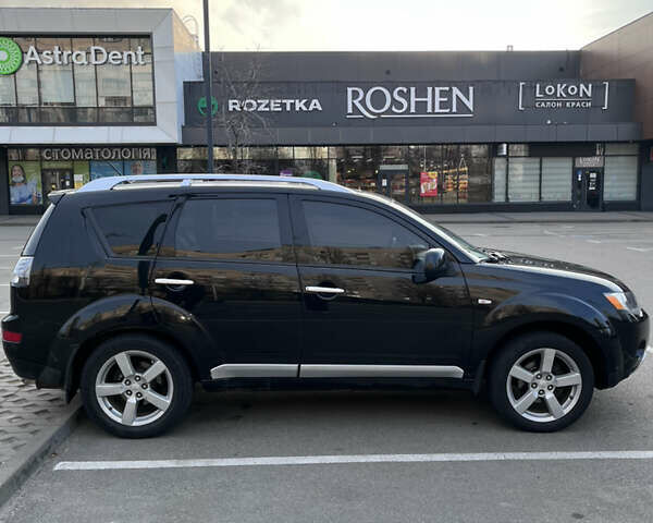 Черный Мицубиси Аутлендер, объемом двигателя 2.4 л и пробегом 237 тыс. км за 5000 $, фото 7 на Automoto.ua