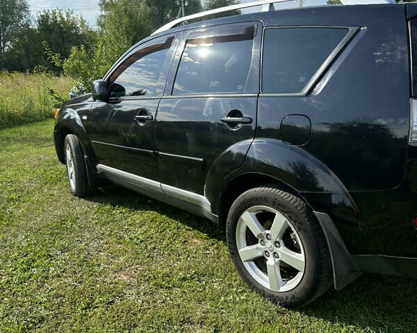 Черный Мицубиси Аутлендер, объемом двигателя 2.36 л и пробегом 240 тыс. км за 9599 $, фото 5 на Automoto.ua