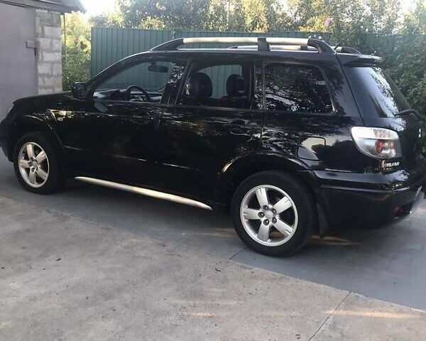 Чорний Міцубісі Аутлендер, об'ємом двигуна 2.38 л та пробігом 207 тис. км за 7000 $, фото 65 на Automoto.ua