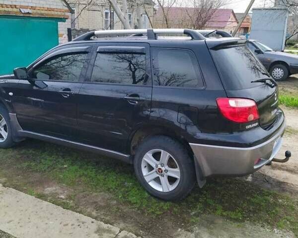 Черный Мицубиси Аутлендер, объемом двигателя 2 л и пробегом 263 тыс. км за 6900 $, фото 5 на Automoto.ua