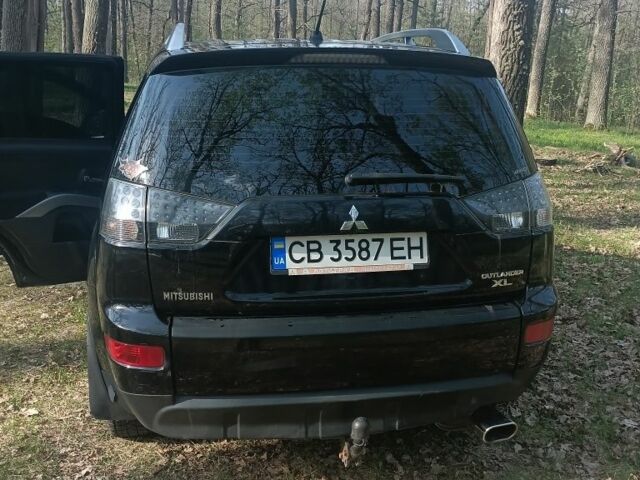 Чорний Міцубісі Аутлендер, об'ємом двигуна 2.4 л та пробігом 222 тис. км за 10000 $, фото 8 на Automoto.ua