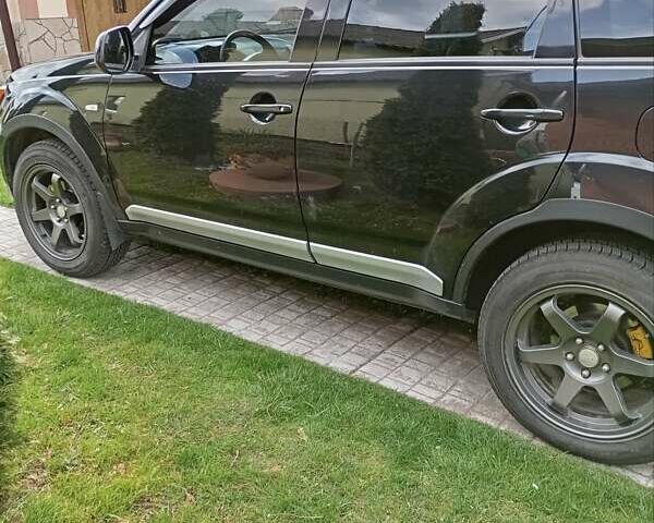 Черный Мицубиси Аутлендер, объемом двигателя 2.35 л и пробегом 245 тыс. км за 8000 $, фото 18 на Automoto.ua