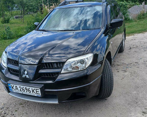 Чорний Міцубісі Аутлендер, об'ємом двигуна 2 л та пробігом 161 тис. км за 7499 $, фото 7 на Automoto.ua