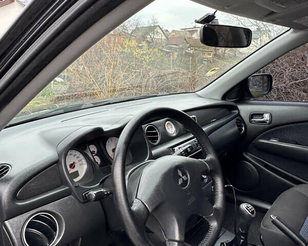 Чорний Міцубісі Аутлендер, об'ємом двигуна 2 л та пробігом 118 тис. км за 8100 $, фото 39 на Automoto.ua