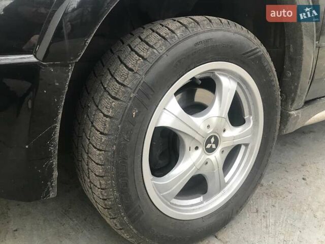 Чорний Міцубісі Аутлендер, об'ємом двигуна 2.38 л та пробігом 207 тис. км за 7000 $, фото 42 на Automoto.ua