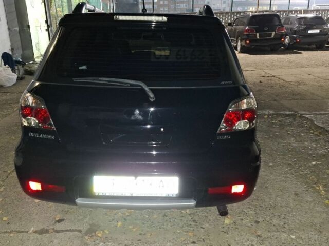 Чорний Міцубісі Аутлендер, об'ємом двигуна 2 л та пробігом 117 тис. км за 7900 $, фото 5 на Automoto.ua