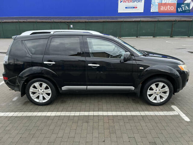 Черный Мицубиси Аутлендер, объемом двигателя 1.97 л и пробегом 244 тыс. км за 8800 $, фото 5 на Automoto.ua