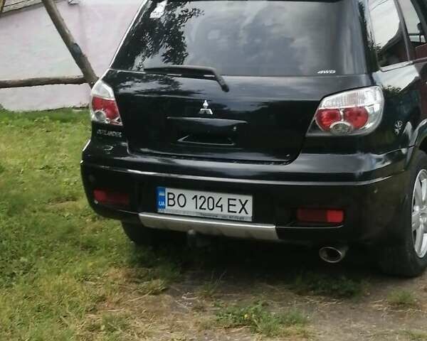 Чорний Міцубісі Аутлендер, об'ємом двигуна 2 л та пробігом 208 тис. км за 6700 $, фото 3 на Automoto.ua