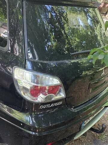 Черный Мицубиси Аутлендер, объемом двигателя 2.4 л и пробегом 150 тыс. км за 6300 $, фото 6 на Automoto.ua