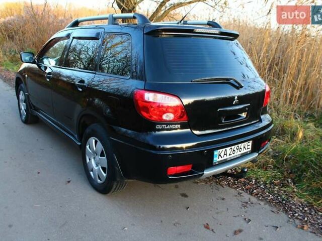 Черный Мицубиси Аутлендер, объемом двигателя 2 л и пробегом 189 тыс. км за 7200 $, фото 45 на Automoto.ua