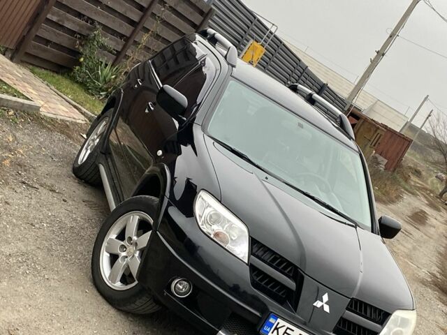 Черный Мицубиси Аутлендер, объемом двигателя 2.4 л и пробегом 178 тыс. км за 6900 $, фото 2 на Automoto.ua