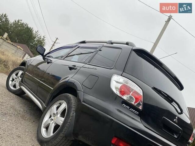Черный Мицубиси Аутлендер, объемом двигателя 2.4 л и пробегом 178 тыс. км за 6900 $, фото 22 на Automoto.ua
