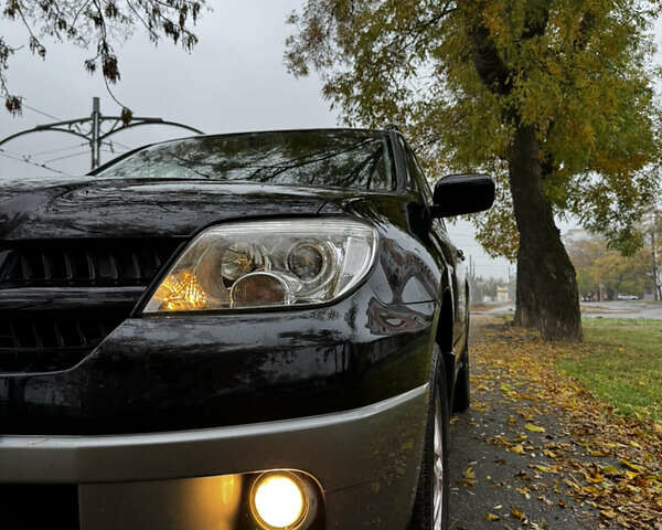 Чорний Міцубісі Аутлендер, об'ємом двигуна 2 л та пробігом 254 тис. км за 7499 $, фото 4 на Automoto.ua