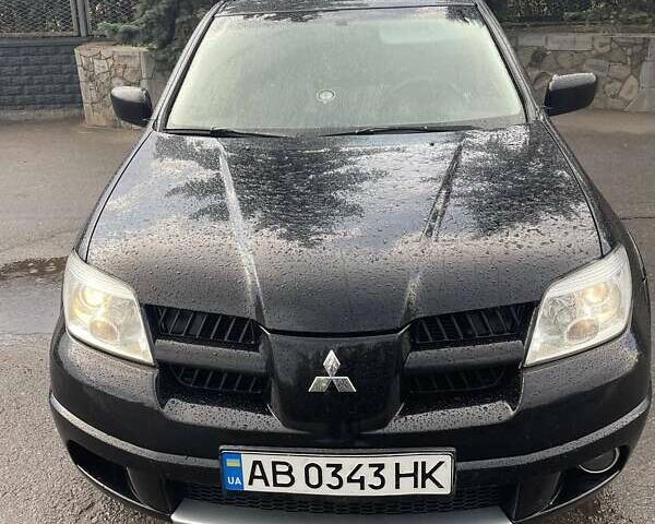 Чорний Міцубісі Аутлендер, об'ємом двигуна 2.38 л та пробігом 249 тис. км за 6100 $, фото 1 на Automoto.ua