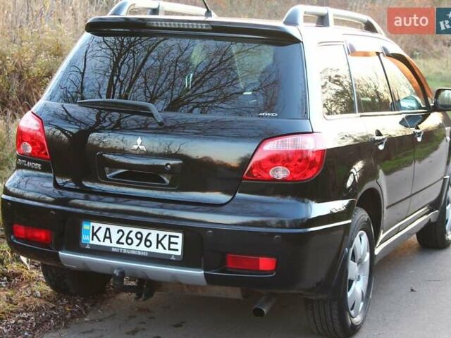 Черный Мицубиси Аутлендер, объемом двигателя 2 л и пробегом 190 тыс. км за 6900 $, фото 13 на Automoto.ua