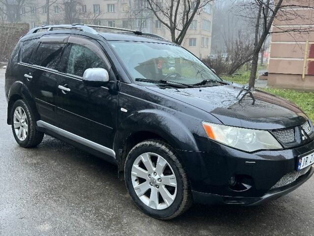 Чорний Міцубісі Аутлендер, об'ємом двигуна 2 л та пробігом 330 тис. км за 4900 $, фото 1 на Automoto.ua