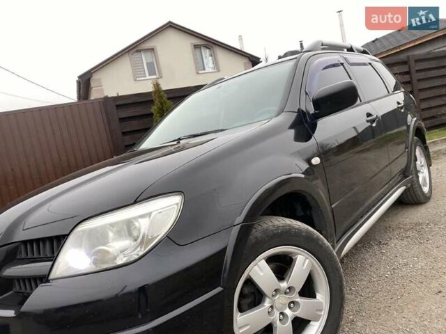 Черный Мицубиси Аутлендер, объемом двигателя 2.4 л и пробегом 178 тыс. км за 6900 $, фото 13 на Automoto.ua