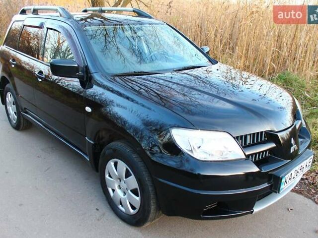 Черный Мицубиси Аутлендер, объемом двигателя 2 л и пробегом 190 тыс. км за 6900 $, фото 16 на Automoto.ua