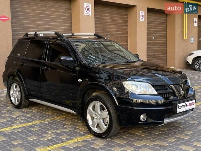 Черный Мицубиси Аутлендер, объемом двигателя 2 л и пробегом 270 тыс. км за 7199 $, фото 8 на Automoto.ua