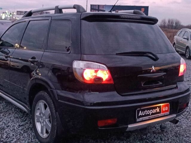 Черный Мицубиси Аутлендер, объемом двигателя 2 л и пробегом 271 тыс. км за 6940 $, фото 6 на Automoto.ua