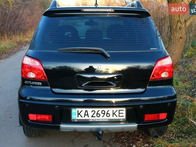 Черный Мицубиси Аутлендер, объемом двигателя 2 л и пробегом 190 тыс. км за 6900 $, фото 27 на Automoto.ua