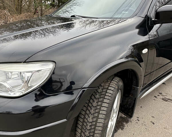 Чорний Міцубісі Аутлендер, об'ємом двигуна 2 л та пробігом 118 тис. км за 8100 $, фото 37 на Automoto.ua