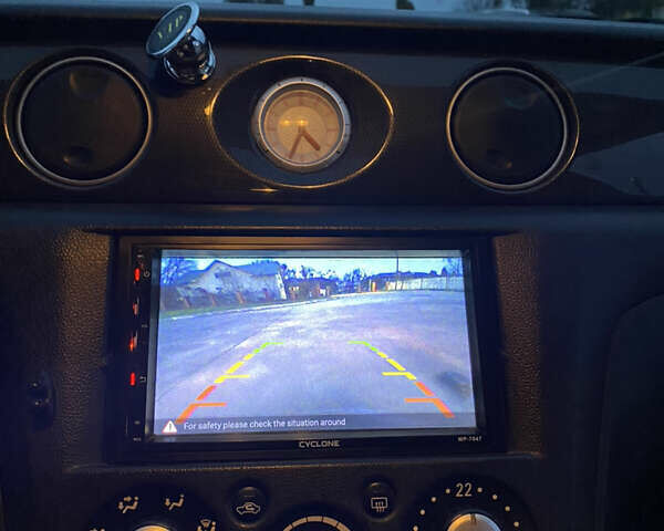 Чорний Міцубісі Аутлендер, об'ємом двигуна 2 л та пробігом 271 тис. км за 6799 $, фото 12 на Automoto.ua