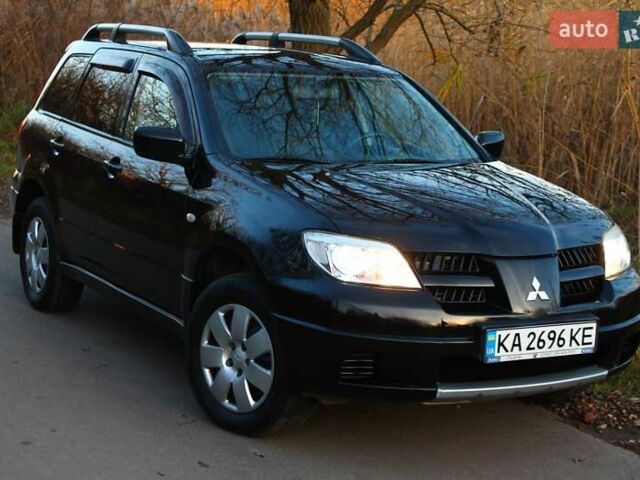 Черный Мицубиси Аутлендер, объемом двигателя 2 л и пробегом 189 тыс. км за 7200 $, фото 9 на Automoto.ua