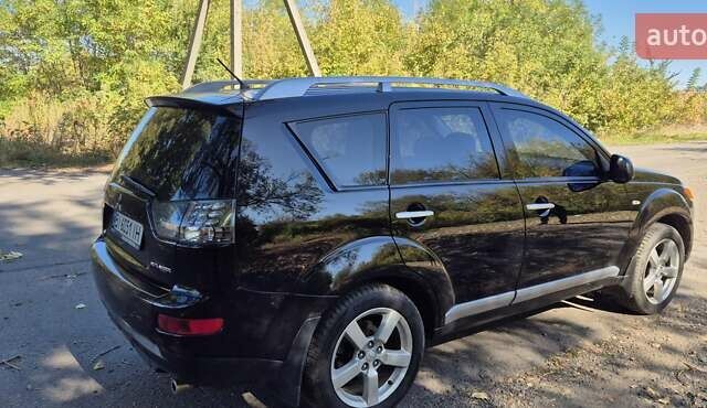 Черный Мицубиси Аутлендер, объемом двигателя 2.4 л и пробегом 178 тыс. км за 9150 $, фото 3 на Automoto.ua