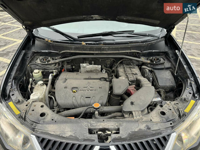 Черный Мицубиси Аутлендер, объемом двигателя 2.36 л и пробегом 120 тыс. км за 10100 $, фото 22 на Automoto.ua