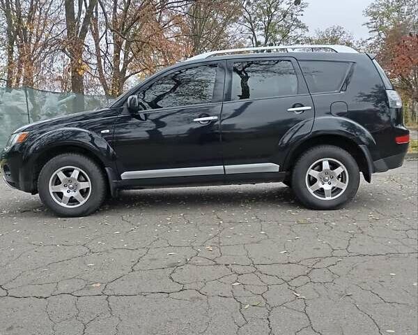 Чорний Міцубісі Аутлендер, об'ємом двигуна 2.36 л та пробігом 265 тис. км за 8800 $, фото 19 на Automoto.ua