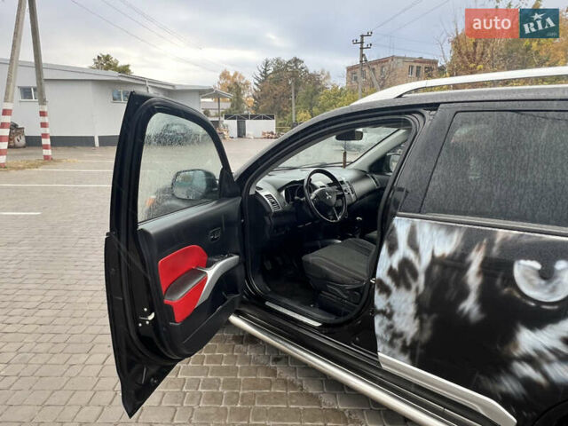 Черный Мицубиси Аутлендер, объемом двигателя 2.4 л и пробегом 230 тыс. км за 6650 $, фото 26 на Automoto.ua
