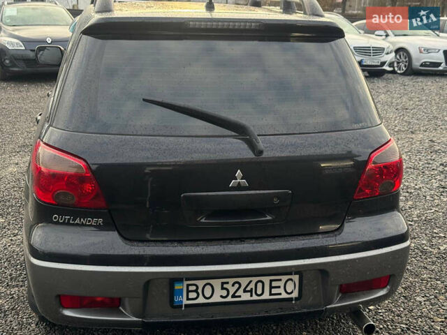 Черный Мицубиси Аутлендер, объемом двигателя 2 л и пробегом 240 тыс. км за 5500 $, фото 5 на Automoto.ua