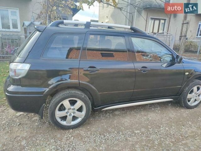 Міцубісі Аутлендер 2008 у Івано-Франківську на Automoto.ua Чорний Міцубісі Аутлендер, об'ємом двигуна 2 л та пробігом 128 тис. км за 7000 $, фото 17 на Automoto.ua