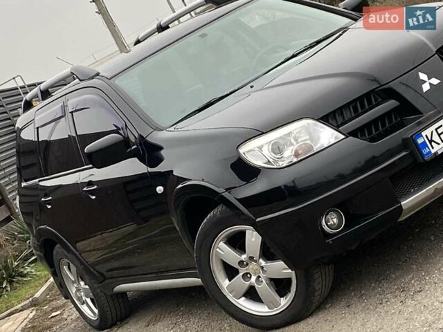 Черный Мицубиси Аутлендер, объемом двигателя 2.4 л и пробегом 178 тыс. км за 6900 $, фото 3 на Automoto.ua