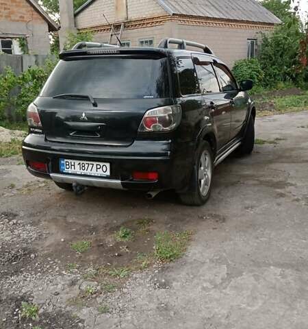 Черный Мицубиси Аутлендер, объемом двигателя 2 л и пробегом 240 тыс. км за 6500 $, фото 6 на Automoto.ua