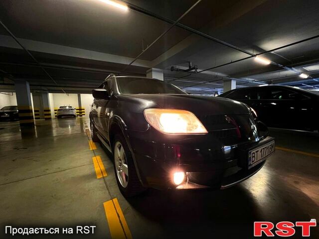 Черный Мицубиси Аутлендер, объемом двигателя 2.4 л и пробегом 260 тыс. км за 8100 $, фото 1 на Automoto.ua