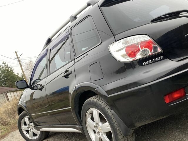 Черный Мицубиси Аутлендер, объемом двигателя 2.4 л и пробегом 178 тыс. км за 6900 $, фото 15 на Automoto.ua