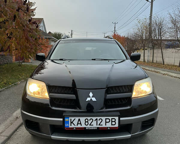 Мицубиси Аутлендер 2008 в Киеве на Automoto.ua Черный Мицубиси Аутлендер, объемом двигателя 2 л и пробегом 245 тыс. км за 5900 $, фото 1 на Automoto.ua