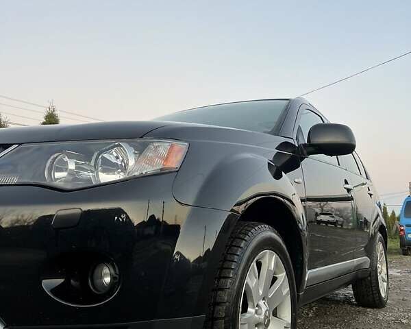 Черный Мицубиси Аутлендер, объемом двигателя 2.2 л и пробегом 310 тыс. км за 9700 $, фото 1 на Automoto.ua