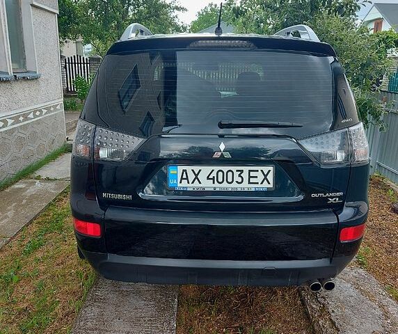 Черный Мицубиси Аутлендер, объемом двигателя 3 л и пробегом 143 тыс. км за 9500 $, фото 2 на Automoto.ua
