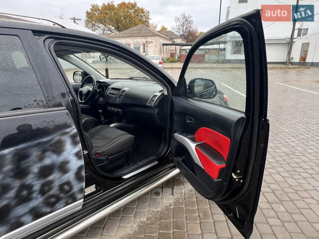 Черный Мицубиси Аутлендер, объемом двигателя 2.4 л и пробегом 230 тыс. км за 6650 $, фото 48 на Automoto.ua