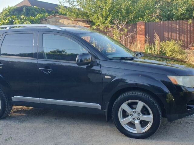 Чорний Міцубісі Аутлендер, об'ємом двигуна 2.4 л та пробігом 325 тис. км за 7500 $, фото 1 на Automoto.ua