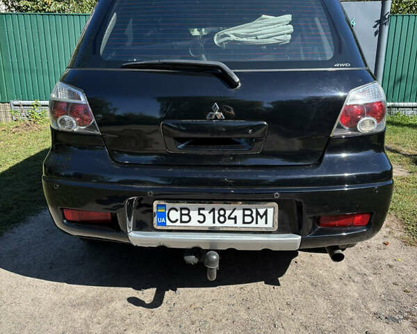 Міцубісі Аутлендер 2008 у Києві на Automoto.ua Чорний Міцубісі Аутлендер, об'ємом двигуна 2 л та пробігом 228 тис. км за 7300 $, фото 4 на Automoto.ua
