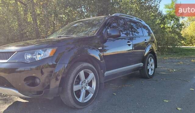 Черный Мицубиси Аутлендер, объемом двигателя 2.4 л и пробегом 178 тыс. км за 9150 $, фото 6 на Automoto.ua