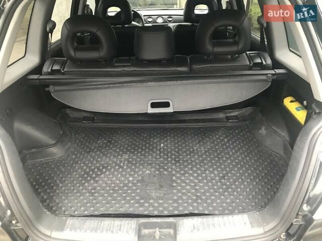 Чорний Міцубісі Аутлендер, об'ємом двигуна 2.38 л та пробігом 207 тис. км за 7000 $, фото 24 на Automoto.ua